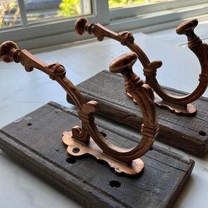 Vintage large bronze and wood coat hooks.